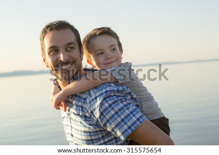 A Father with is son at the sunset