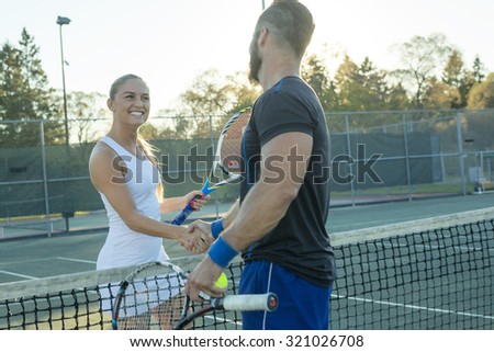 Two Happy Tennis Players having fun to play