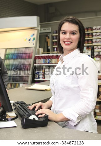 A home design shop with employee clerk and client at the cashier.