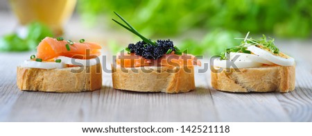 fresh baguettes with salmon, caviar and egg