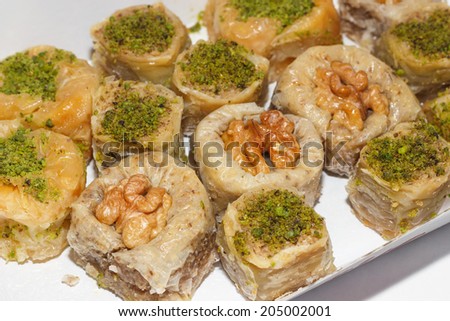 Various kinds turkish baklava with pistachios and walnut in box