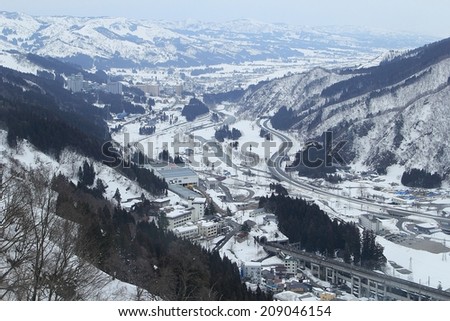 YUZAWA , JAPAN - FEBRUARY 27,2014: Yuzawa is one of the main ski and snowboard towns in Japan, a snow paradise hosting over 6 million skiers and snowboarders per year.