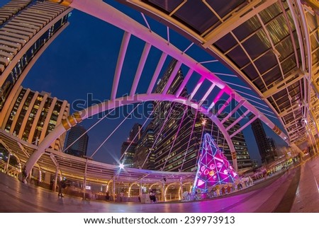 BANGKOK - DEC 19 :Buildings and a sky walk architecture like a spider for transit between Sky Transit and Bus Rapid Transit Systems Sathorn-Narathiwas junction on December 19, 2014 in Bangkok, Thailand.