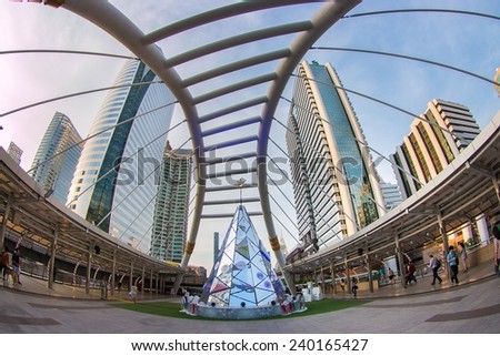 BANGKOK - DEC 19 :Buildings and a sky walk architecture like spider for transit between Sky Transit and Bus Rapid Transit Systems Sathorn-Narathiwas junction on December 19, 2014 in Bangkok, Thailand.