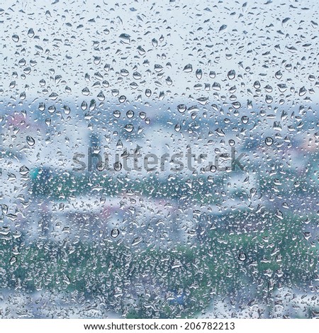 rain drop on the glass window in rainy season, Thailand