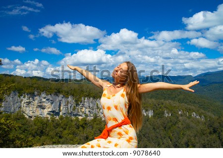 Beautiful girl with arms wide open