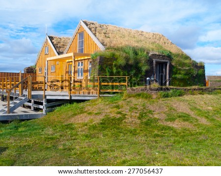Typical wooden scandinavian house with grass roof, thermoregulation