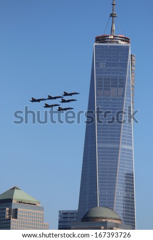 NEW YORK CITY - December 13, 2013: The US Navy Blue Angels Fly Past 1 World Trade Center, in New York City, NY.
