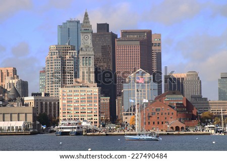 The Customs House Clock Tower, the American Flag Flying, and Boston Skyline, Massachusetts, New England.