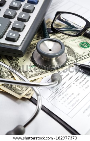 stethoscope pen glasses and dollar on blank Patient information
