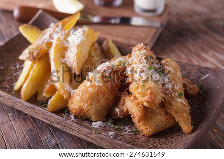 Fish and chips with potato wedge
