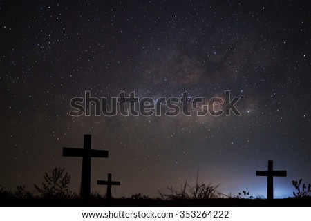 Silhouette of cross over milky way background,Long exposure photograph