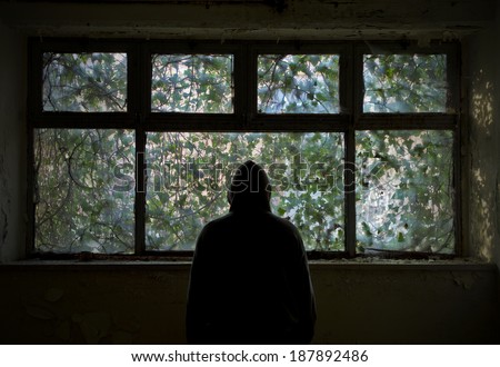 Man in front at window
