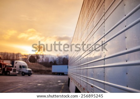 Truck trailers in sunset