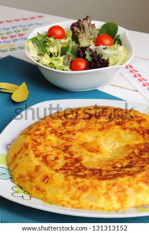 Omelet, spanish tortilla or omelette with potatoes and salad