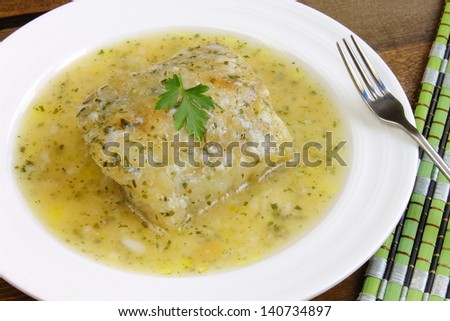 Fish fillet in a green sauce