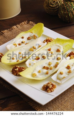 Endive or chicory salad with blue cheese dressing and walnuts