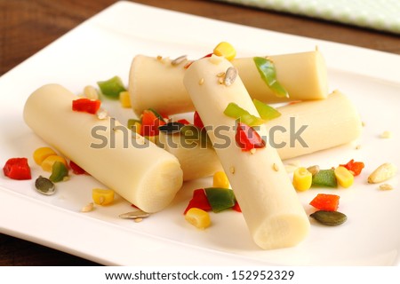 Hearts of palm salad with bell peppers, corn and nuts