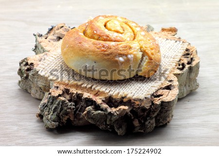 Cinnamon roll (also Coffee scroll, cinnamon bun, cinnamon swirl, cinnamon snail and kanelbulle in Sweden)