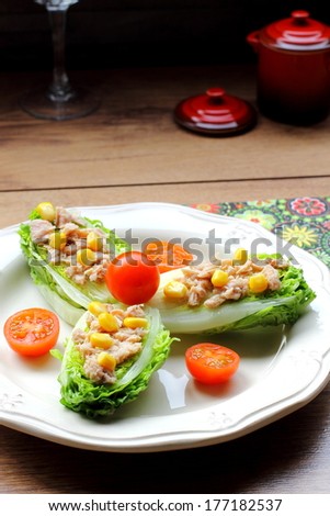 Romaine lettuce hearts salad with tuna, corn and cherry tomatoes