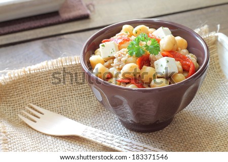 Chickpea salad with tuna, bell pepper, feta cheese and herbs