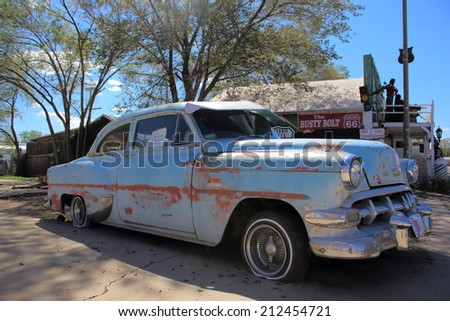 SELIGMAN, ARIZONA - AUGUST 16, 2014: Old car parked on the Mother Road, on August 16, 2014 in Seligman, AZ. Seligman is famous as origin of Route 66 and inspiration for the town of the movie Cars.