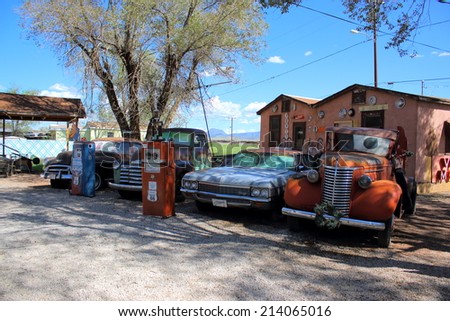 SELIGMAN, ARIZONA - AUGUST 16, 2014: Old cars parked on Mother Road, on August 16, 2014 in Seligman, AZ. Seligman is famous as origin of Route 66 and inspiration for the town of the movie Cars.