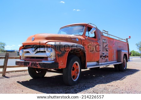 SELIGMAN, ARIZONA - AUGUST 16, 2014: Old fire truck parked on the Mother Road, on August 16, 2014 in Seligman, AZ. Seligman is famous as origin of Route 66 and inspiration for the town of movie Cars.