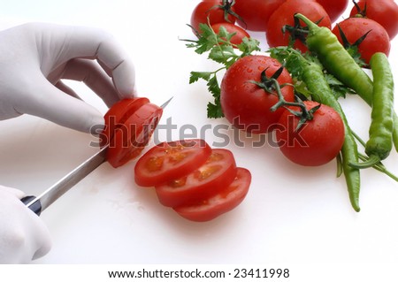 chief cut tomatoes at the kitchen