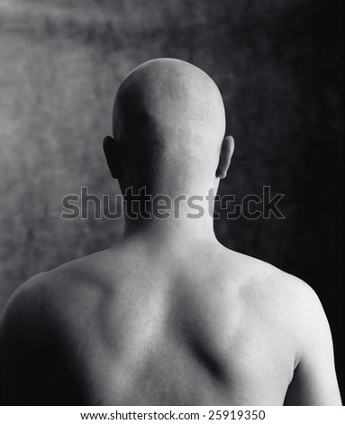 bald head on the black black background