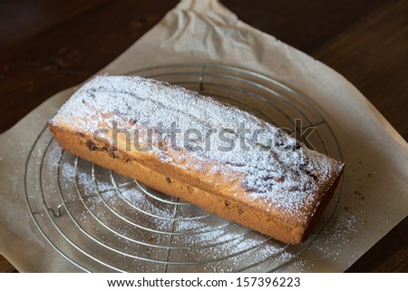 Powdered sugar is applied to marble cake