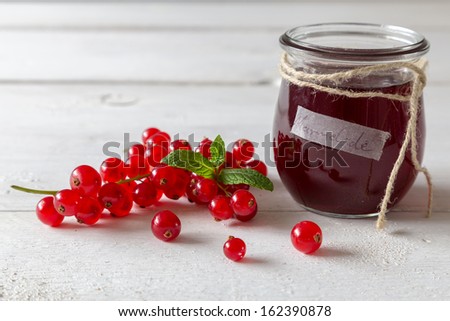Currant jam in a jar with cord