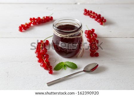 Currant jam in a jar with cord