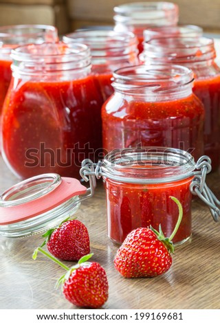 Strawberry jam cooking finished jam in jars.