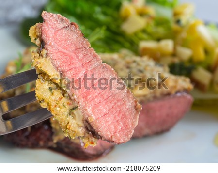 Beef steak with mustard herb crust and romaine lettuce hearts with mango apple vinaigrette.