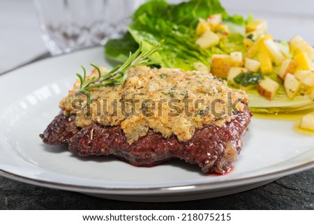 Beef steak with mustard herb crust and romaine lettuce hearts with mango apple vinaigrette.