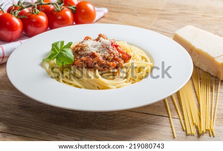 Spaghetti with Bolognese Sauce Parmesan and basil.
