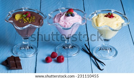 Dessert variation chocolate cream raspberry cream vanilla cream.