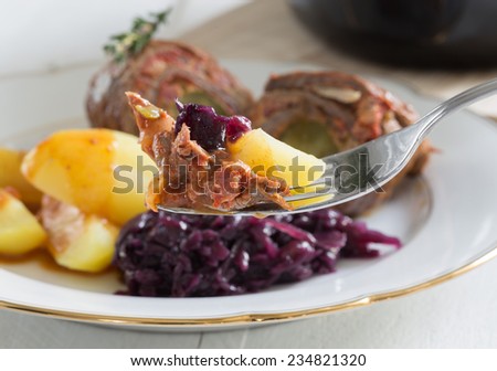 Roulade of beef with potatoes and red cabbage.