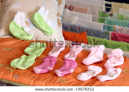 Socks for baby girl on a drying rack