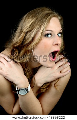 stock photo Shy girl caught naked trying to hide her breasts isolated on 