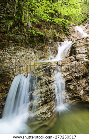 Waterfall near Aschau im Chiemgau with fresh green leaves, Aschau, Bavaria, Germany