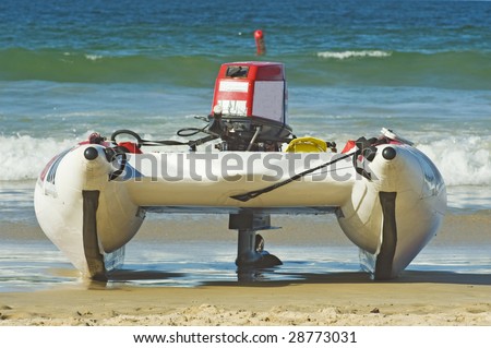 A fast inflatable Racing Boat on the beach ready to race