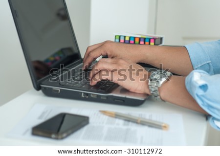Close up of business man hand working on paper  on desk as concept