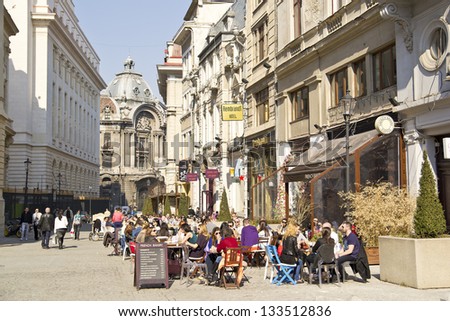 BUCHAREST, ROMANIA - MARCH 18: People enjoy the first days of spring downtown Lipscani Street on March 18, 2012 in Bucharest, Romania.