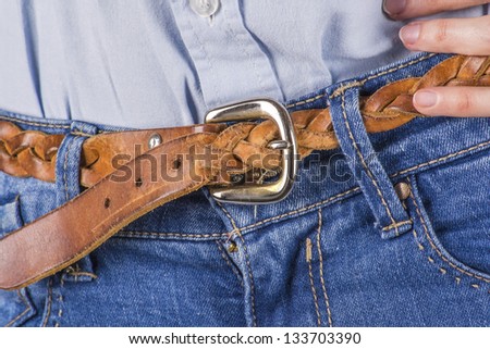 Young Woman Wearing Casual Clothes Shirt, Jeans And Stranded Leather Belt