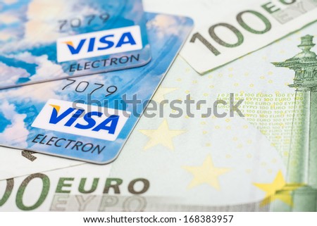 BUCHAREST, ROMANIA - DECEMBER 22, 2013: Visa Credit Cards Over European Union Official Euro Banknotes
