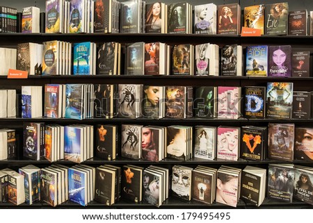 BUCHAREST, ROMANIA - MARCH 01, 2014: Modern Novels Books Displayed On Library Shelf.