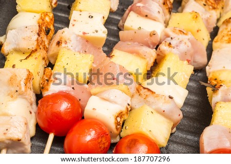 Exotic Skewers With Chicken Meat, Cherry Tomatoes, Pineapple And Mozzarella