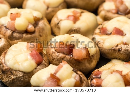 Fried Champignon Mushrooms With Baked Ham And Melted Cheese